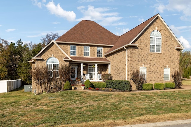 view of front of home featuring a porch and a front lawn