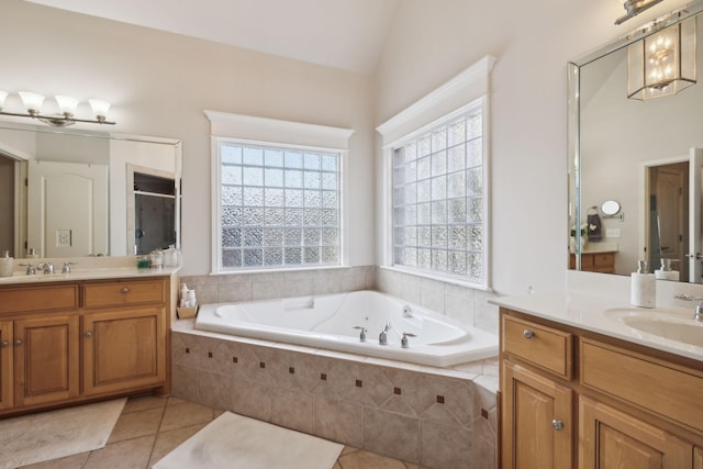 bathroom featuring tile patterned floors, vanity, lofted ceiling, and shower with separate bathtub