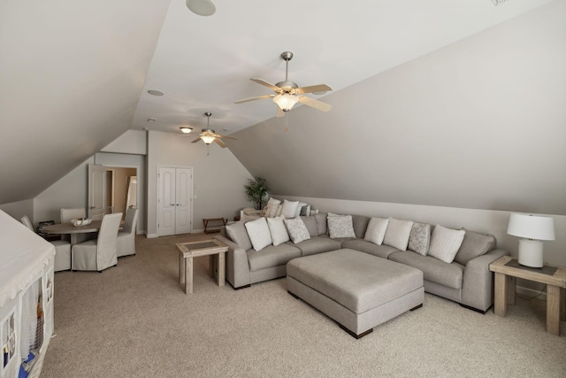 living room with ceiling fan, light carpet, and vaulted ceiling