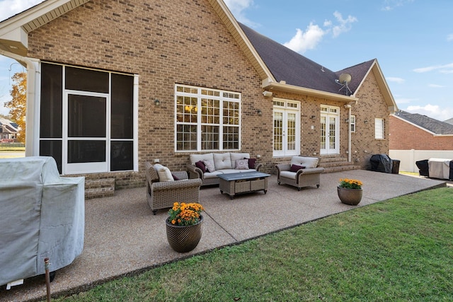 rear view of property with a patio area, an outdoor hangout area, and french doors