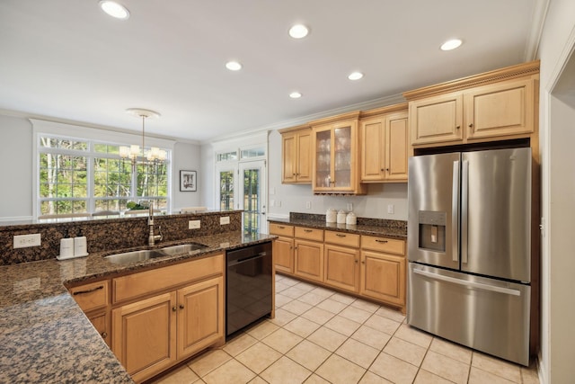 kitchen with pendant lighting, sink, stainless steel fridge, ornamental molding, and black dishwasher