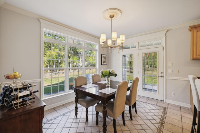 dining room with a notable chandelier, light tile patterned floors, and ornamental molding