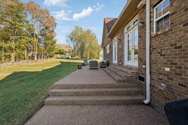 view of yard featuring french doors and a patio