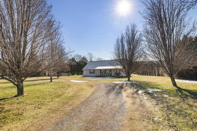 single story home featuring a front yard and covered porch