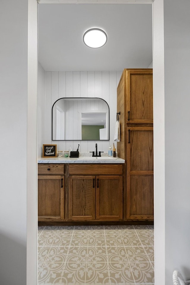 bathroom with vanity and tile patterned flooring