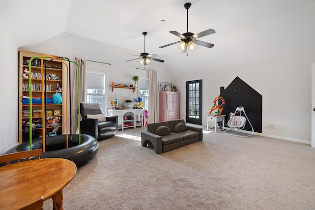 living room with lofted ceiling, ceiling fan, and carpet flooring