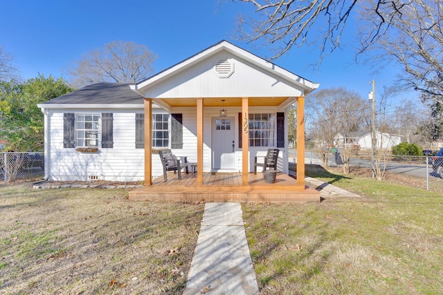 view of front of house with covered porch and a front yard