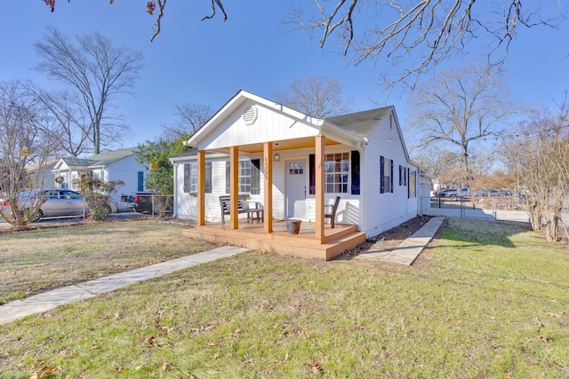 bungalow-style house featuring a porch and a front lawn