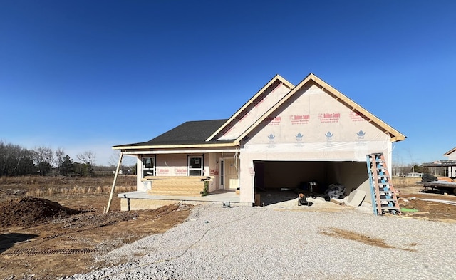 view of front of home featuring a garage and covered porch