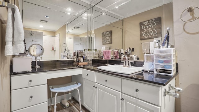 bathroom featuring hardwood / wood-style floors and vanity