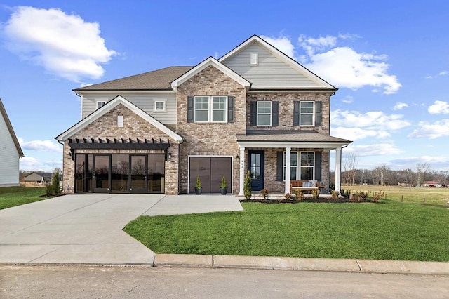 craftsman-style house with a front lawn and a porch