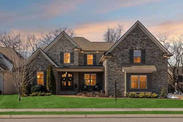 craftsman-style home featuring a yard