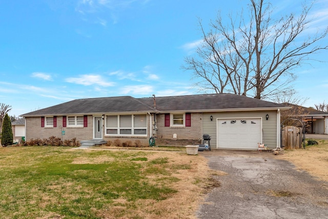 single story home with a garage and a front lawn