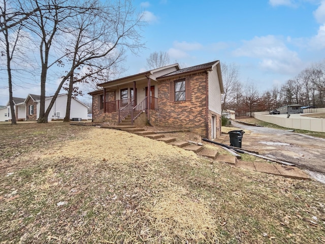 view of front of home with covered porch and a garage