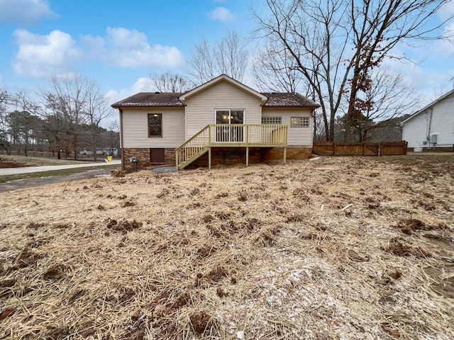 back of property with a deck