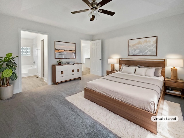 bedroom featuring ceiling fan and ensuite bath