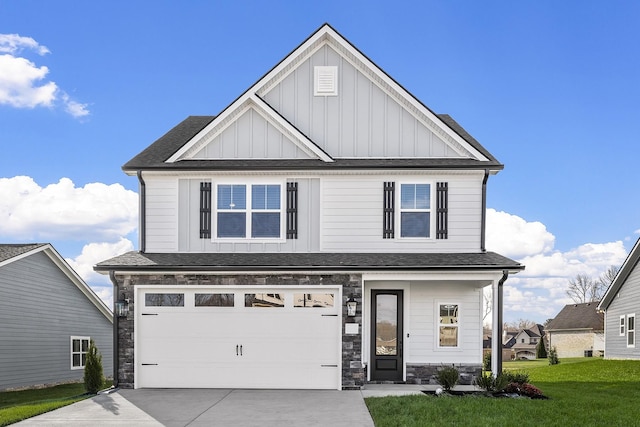 view of front of home with a garage and a front yard