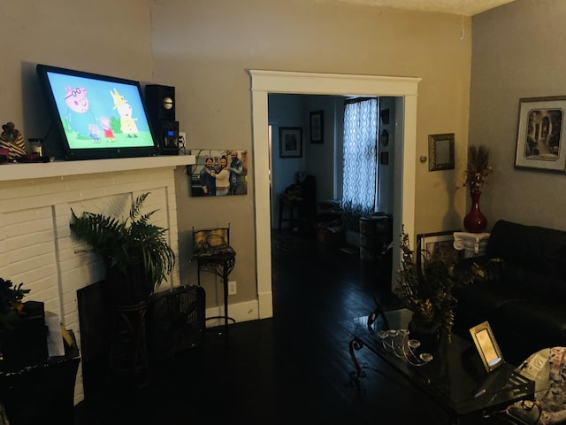 living room with dark hardwood / wood-style flooring