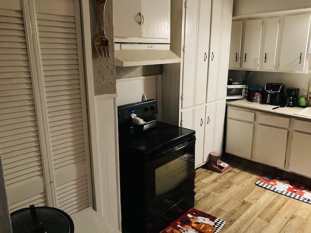 kitchen featuring light hardwood / wood-style flooring and black electric range