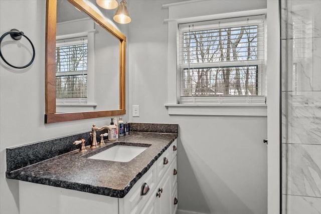 bathroom with vanity and a healthy amount of sunlight