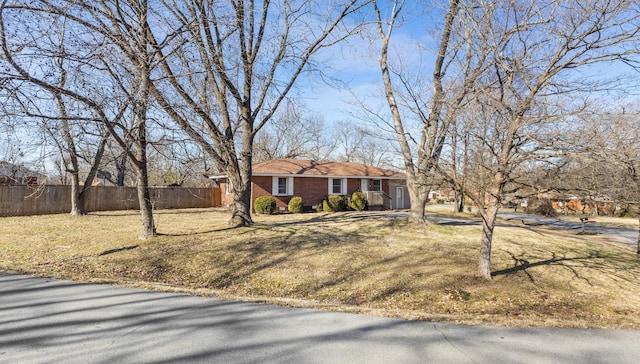 ranch-style house with a front yard