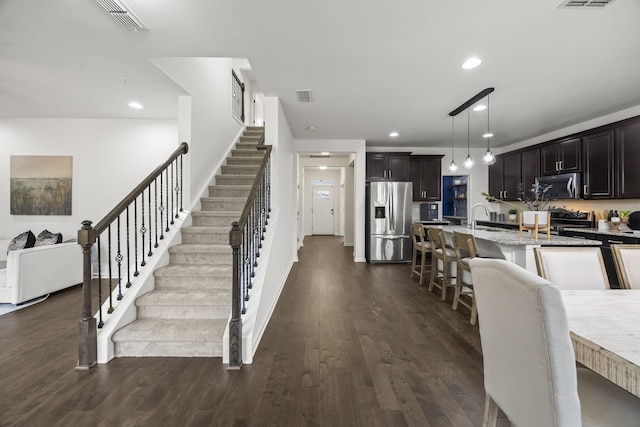 interior space with dark hardwood / wood-style flooring and sink