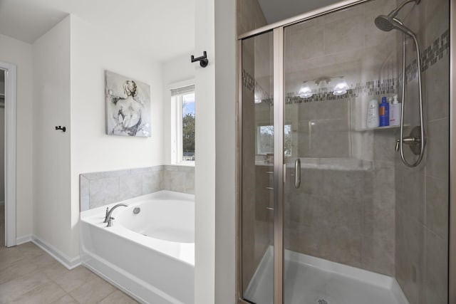 bathroom featuring tile patterned floors and shower with separate bathtub