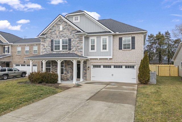 view of front of home featuring a garage, covered porch, and a front lawn