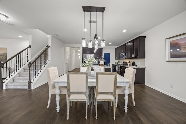 dining area with dark hardwood / wood-style flooring