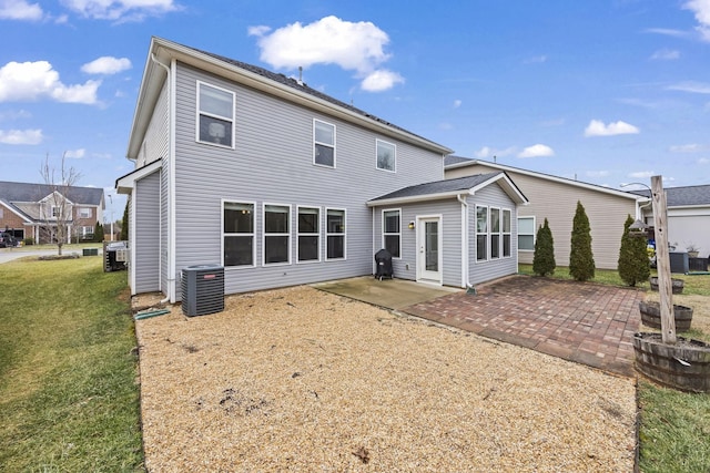 back of house with a patio, a yard, and cooling unit