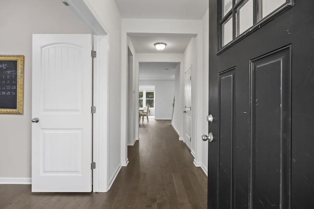 corridor featuring dark hardwood / wood-style flooring