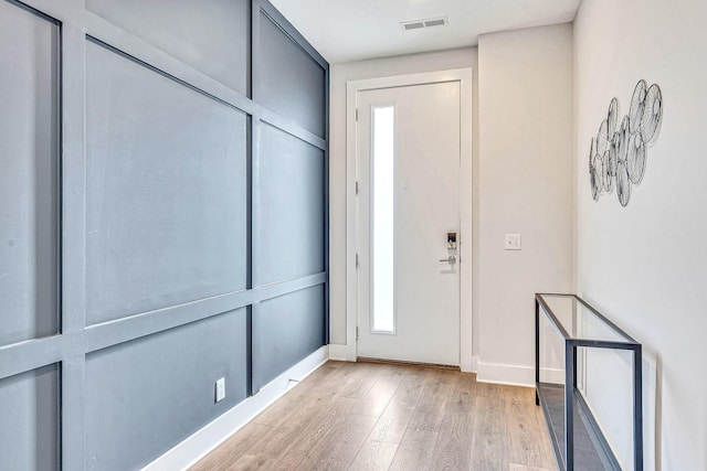 entryway with light hardwood / wood-style flooring