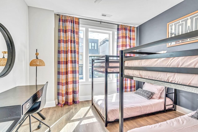 bedroom with light wood-type flooring