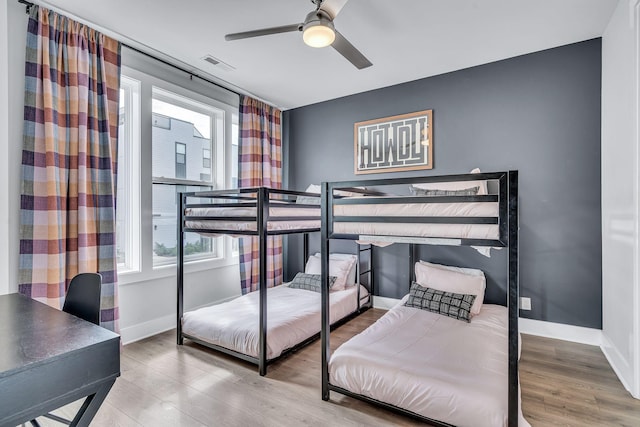 bedroom featuring ceiling fan and hardwood / wood-style flooring