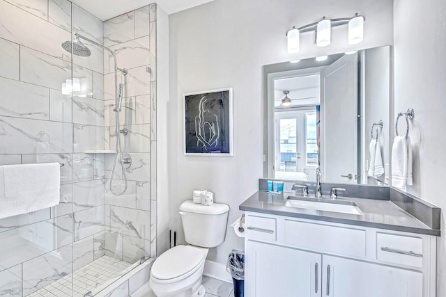 bathroom featuring vanity, an enclosed shower, and toilet