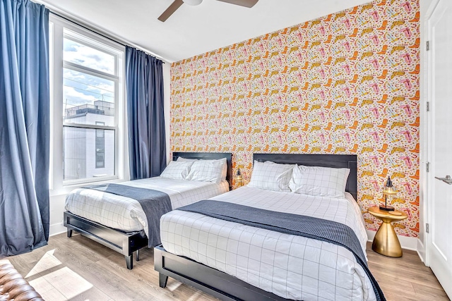 bedroom featuring ceiling fan and light hardwood / wood-style flooring