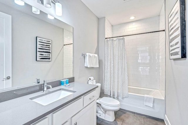 full bathroom with tile patterned flooring, vanity, toilet, and shower / tub combo