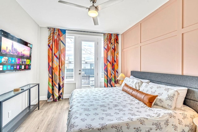 bedroom featuring ceiling fan, light hardwood / wood-style floors, and access to exterior