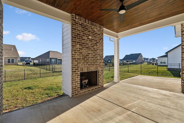 view of patio / terrace with an outdoor brick fireplace and ceiling fan