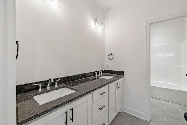 bathroom with tile patterned floors and vanity