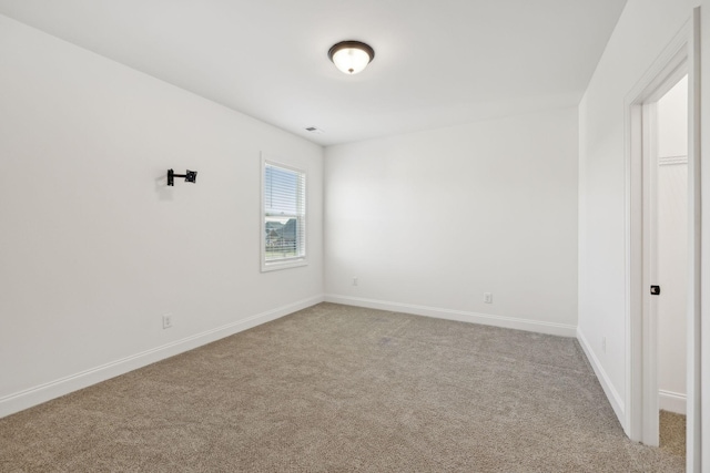 unfurnished bedroom featuring light colored carpet