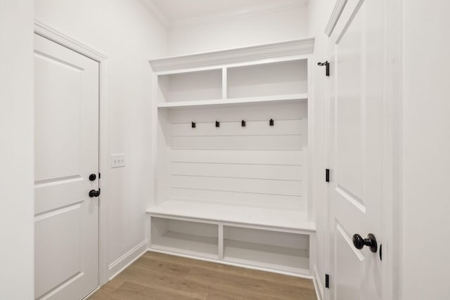 mudroom featuring light hardwood / wood-style flooring and ornamental molding