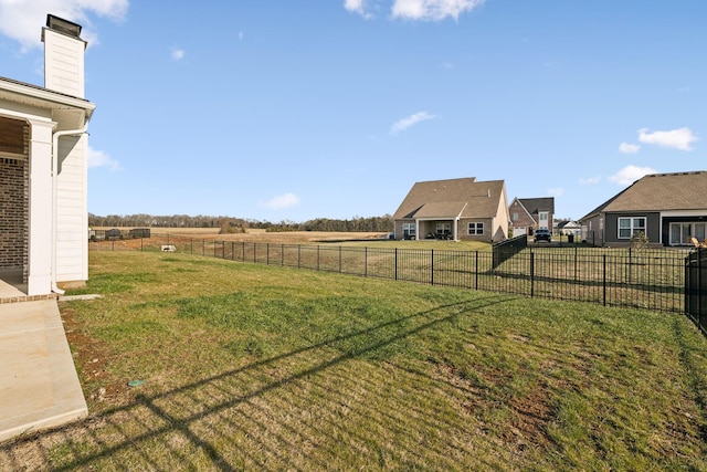 view of yard with a rural view