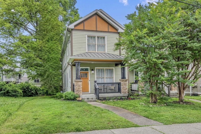 view of front of property featuring a porch and a front yard