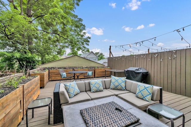 wooden deck with an outdoor hangout area