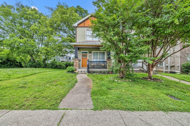 view of front of property with a porch and a front yard