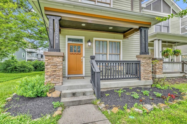 entrance to property featuring a porch