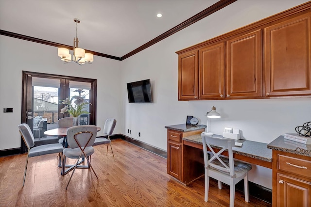 office space with light wood-type flooring, crown molding, and a notable chandelier