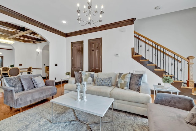 living room featuring ornamental molding, coffered ceiling, wood-type flooring, beamed ceiling, and a chandelier