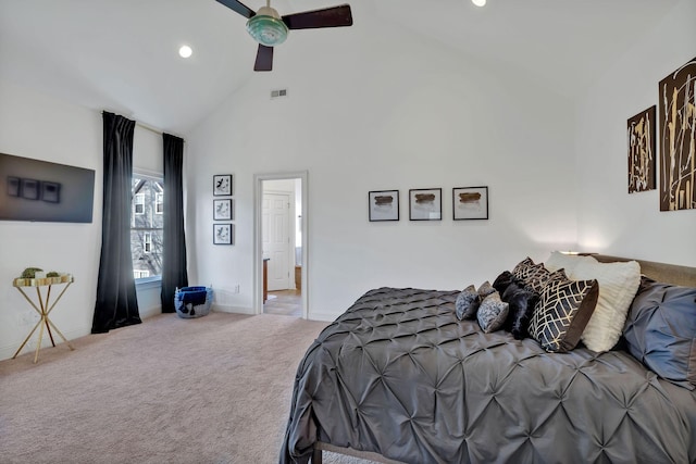 bedroom with ceiling fan, carpet floors, and high vaulted ceiling